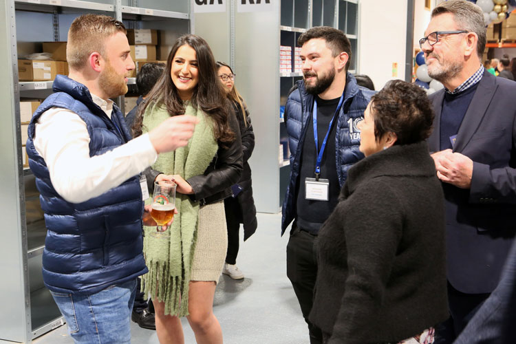 Quality Bearings Online employees with their family and friends enjoying the grand opening night